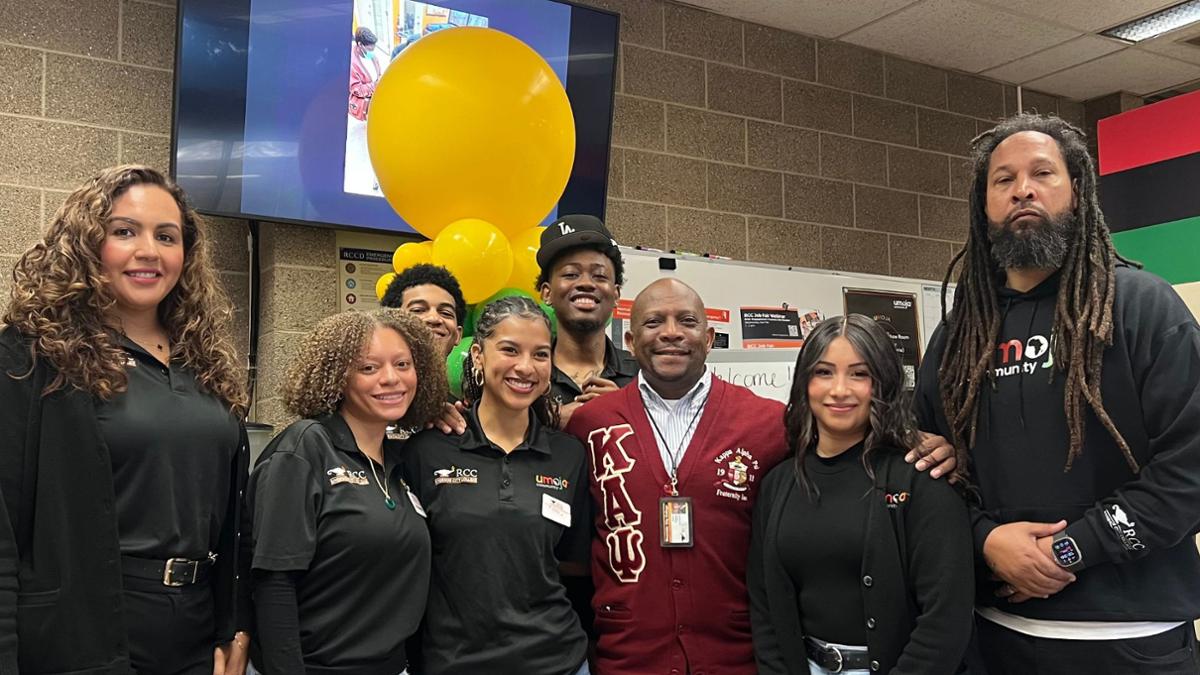 students, advisors and dean english enjoying event. 